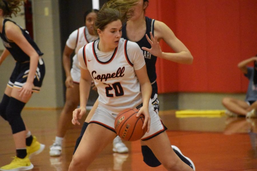 Coppell+junior+guard+Jules+Lamendola+pivots+against+Highland+Park+on+Friday+in+the+Coppell+Large+Gym.+The+Cowgirls+beat+the+Scots%2C+41-37.