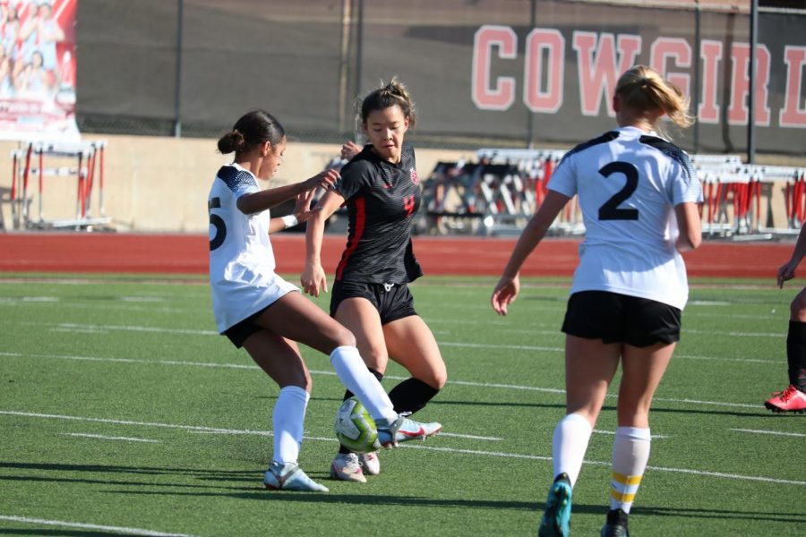 Coppell+senior+forward+Michelle+Pak+dribbles+against+Hebron+on+Feb.+6+at+the+Buddy+Echols+Field.+The+Cowgirls+play+their+first+scrimmage+this+year+against+Lebanon+Trail+at+Buddy+Echols+Field+Monday+at+7%3A30+p.m.