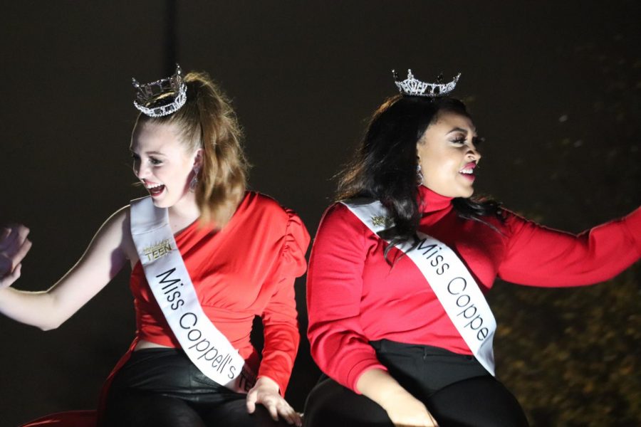 Miss Teen Coppell and Miss Coppell ride atop a Chevy during the Holiday Parade on Parkway Boulevard on Saturday. The Holiday Parade started at 6 p.m. and was followed by the Tree Lighting festival and movies in Andy Brown Park East.