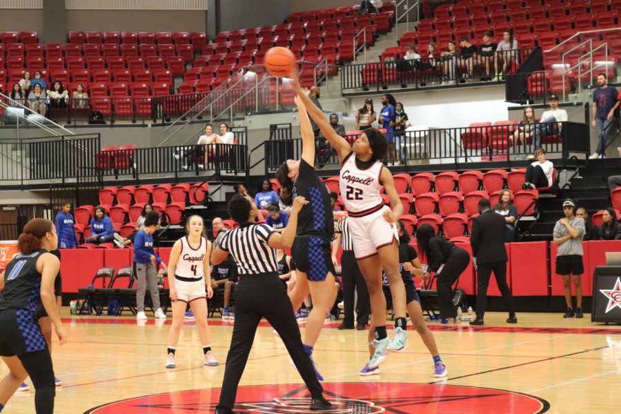 Coppell senior forward India Howard faces Plano West sophomore point guard Aniya Smith for the tipoff on Friday at CHS Arena. The Cowgirls defeated the Wolves, 73-39.