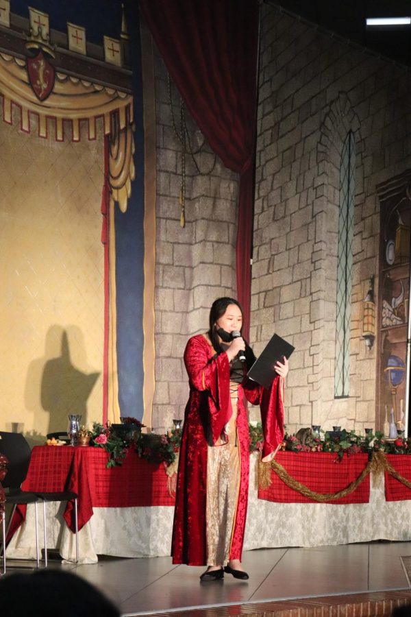 Coppell High School junior Lauren Chieh begins the Madrigal Feast by giving guests background information about the setting of the Madrigals performance on Friday. CHS Choir held its 27th annual Madrigal Feast on Friday and Saturday. 