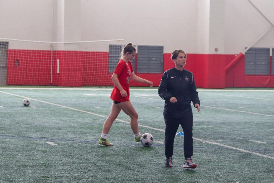 Coppell+girls+soccer+coach+Fleur+Benatar+leads+the+team+through+dribbling+drills+in+CHS+Fieldhouse+on+Jan+27.+Benatar+is+moving+to+University+of+Houston+to+be+the+womens+soccer+assistant+after+one+year+at+Coppell.