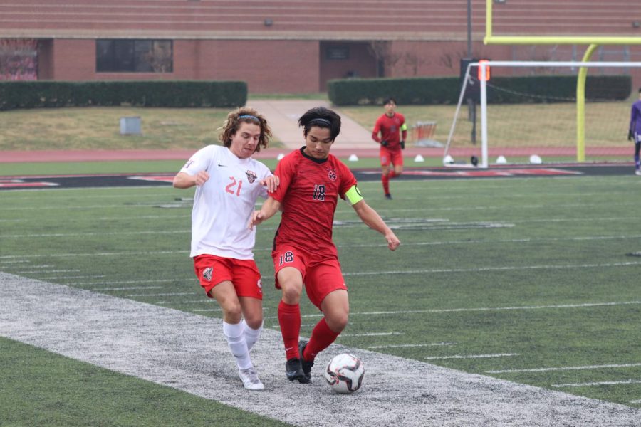 Coppell senior defender Dylan Greenbattles for possession against Rockwall Heath on Jan. 8 in the North Texas Elite Showcase. The Cowboys host Plano tomorrow at Buddy Echols Field, with kickoff at 7:30 p.m. 