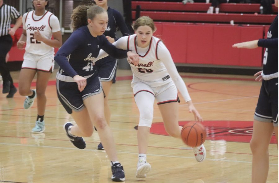Coppell senior guard Jules Lamendola drives through the Flower Mound defense during the third quarter in the CHS Arena on Friday. The Cowgirls won 49-40.