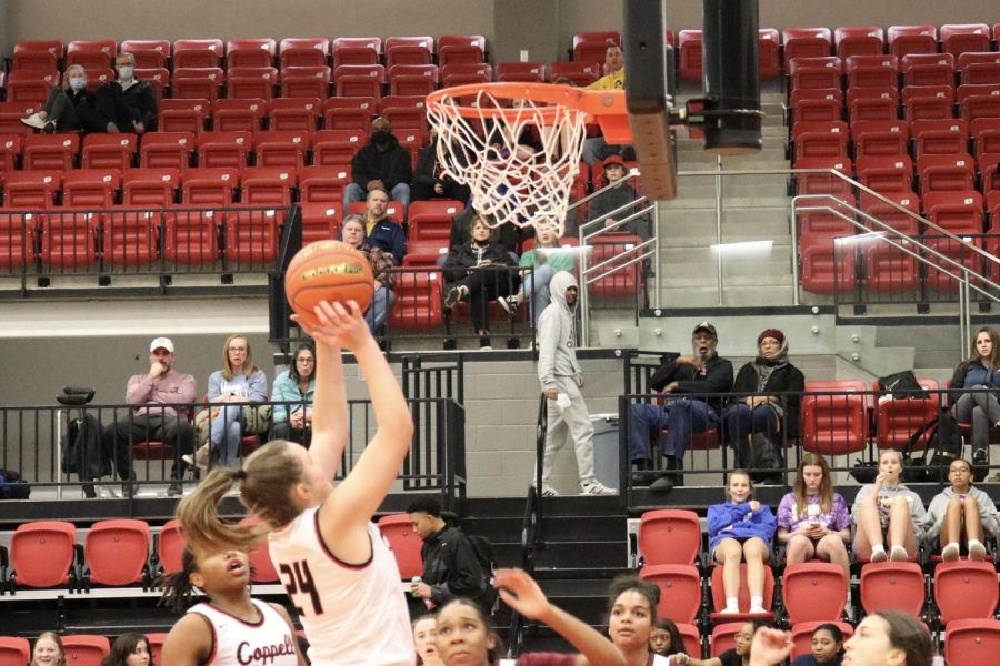 Coppell sophomore forward Berlynn Engelhardt shoots for a layup against Lewisville at the CHS Arena on Friday. The Cowgirls defeated the Farmers, 66-32.