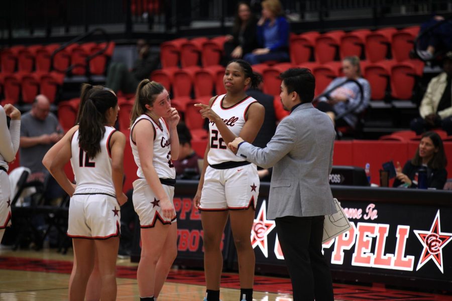Coppell assistant Willis Tran talks to junior guards Saiya Patel and Alyssa Potter, sophomore guard Ella Spiller and senior forward India Howard during halftime at CHS Arena on Jan. 18. The Cowgirls host Flower Mound Marcus tonight at CHS Arena, with tipoff at 6:30 p.m. Photo by Olivia Short