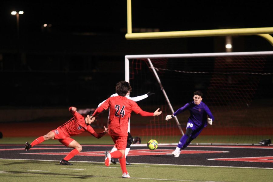 Coppell senior goalkeeper Arath Valdez saves a shot on goal from Plano senior forward Nolan Giles on Tuesday at Buddy Echols Field. The Cowboys tied the Wildcats, 0-0.