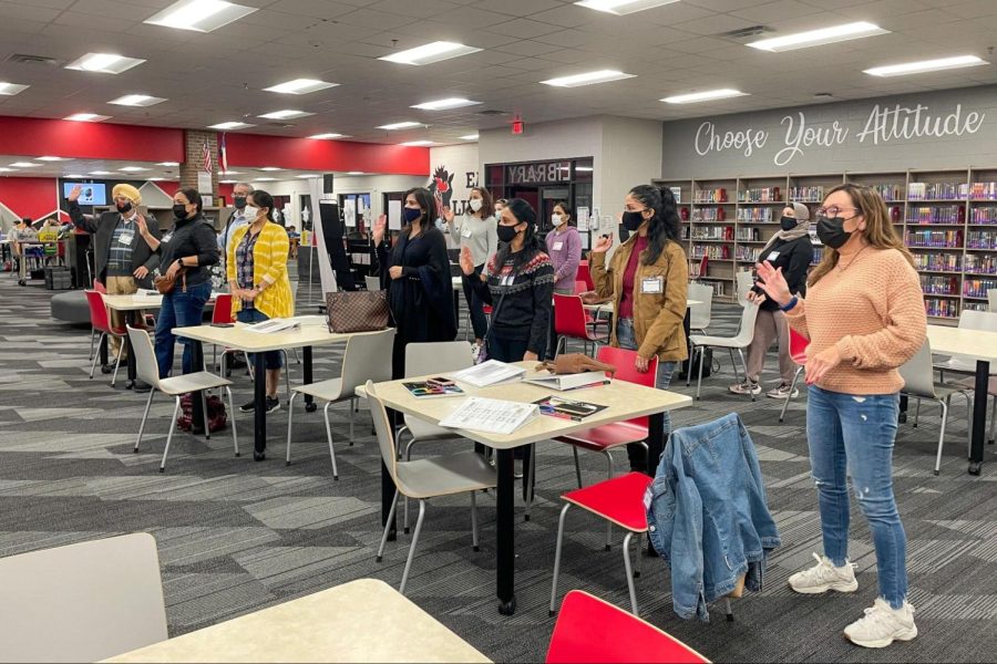 Students in the English Second Language class begin their class with “The Hello Song.” Coppell Middle School East hosts the ESL classes every Tuesday at the CMS East Library.