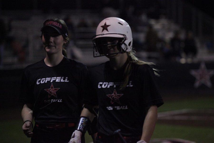 Coppell junior Talia Stuchal congratulates senior Adrianna Erichsen after her home run at the Coppell ISD Baseball/Softball Complex on Friday. Coppell softball scrimmaged against Frisco Lonestar.