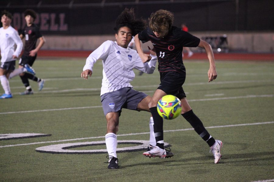 Coppell junior forward Abraham Al Hilalat intercepts a pass from Hebron at Buddy Echols Field on Feb 7. Coppell lost to Hebron, 2-0. 