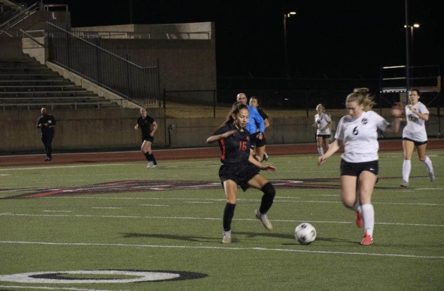 Coppell freshman defender Tabitha Sinen defends Marcus freshman midfielder Maddie Reynolds player during the second half against Marcus Flower Mound Marcus on Tuesday at Buddy Echols Field. The Cowgirls defeated the Marauders, 1-0. 