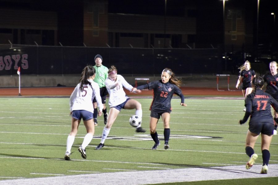 Coppell forward Summer Chen recovers the ball from Plano forward Nathalie Muniz on Feb. 18 at Buddy Echols Field. The Coppell girls soccer team hosts first-place Hebron on Tuesday night.