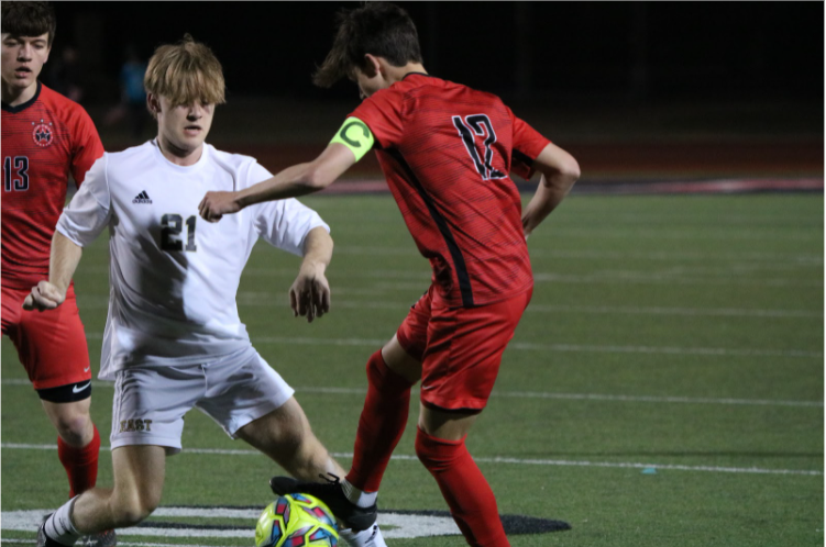 Coppell senior midfielder Walker Stone competes with Plano East for possession at Buddy Echols Field on Friday.