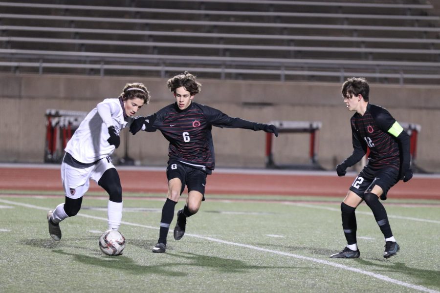 Coppell sophomore midfielder Sam Stone and senior midfielder Walker Stoner defend against Marcus at Buddy Echols Field on Friday. The Cowboys defeated the Marauders, 3-0.