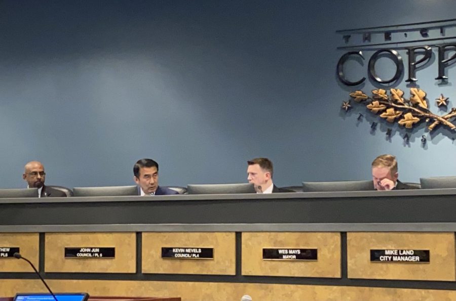 Coppell councilmember John Jun discusses the repeal of the code of conduct with city attorney Robert E. Hager during the city council meeting on Tuesday. In addition to approving the repeal, the council approved of a curfew hours for minors ordinance for another three years. 