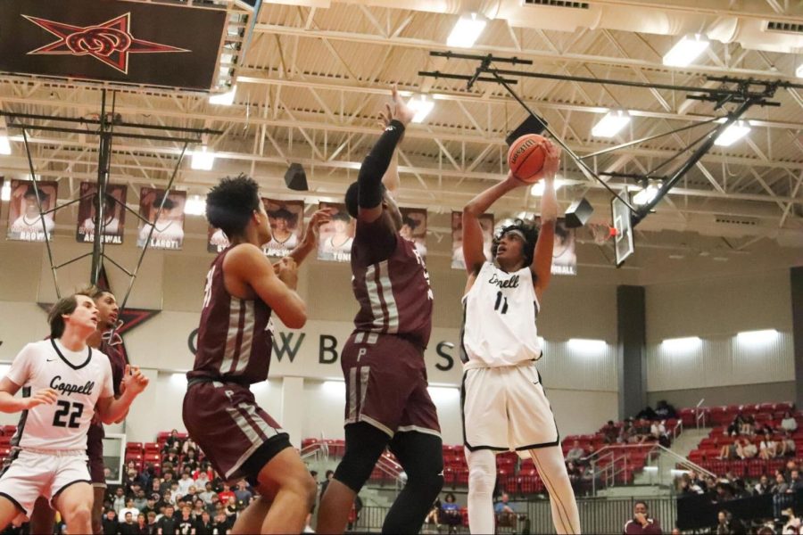 Coppell small forward Ryan Agarwal shoots a jump shot against Plano Senior High at CHS Arena on Friday. Coppell lost, 52-39.