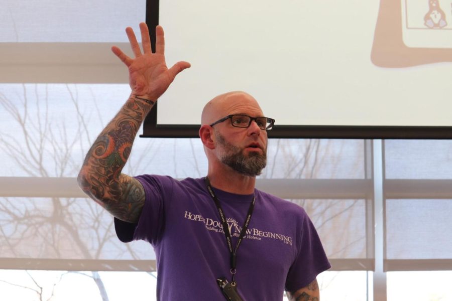 Hope’s Door New Beginning Center community educator Ryan Thomas asks program attendees to raise their hands while discussing dating experiences at the Coppell Cozby Library and Community Commons on Monday. The Coppell Cozby Library hosted a program about healthy relationships in awareness of Teen Dating Violence Awareness Month.