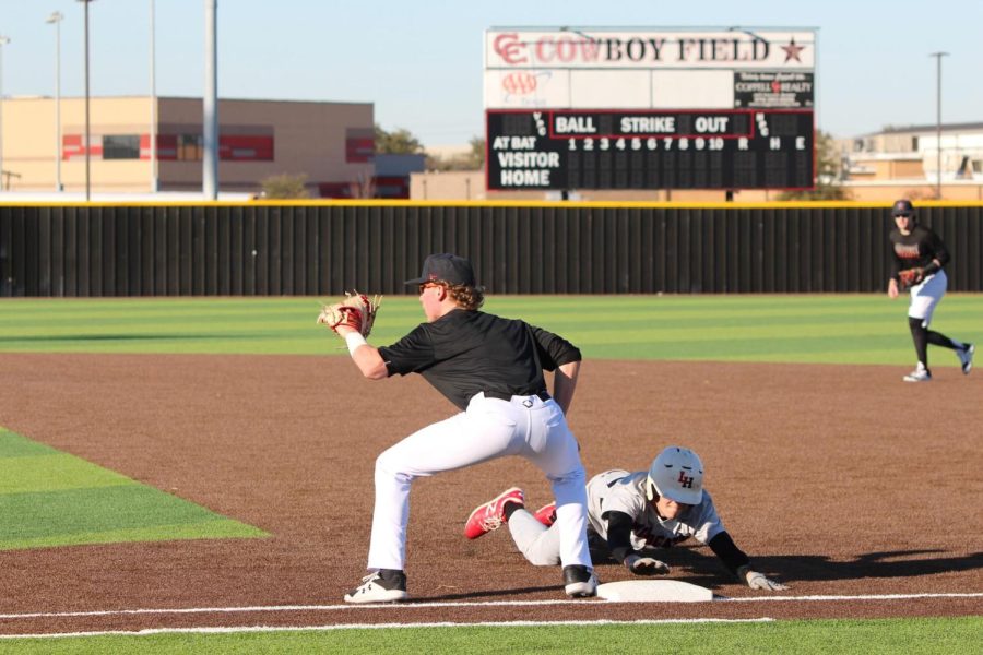 Coppell junior first baseman Andrew Schultz holds a Lake Highlands runner at first base at the Coppell ISD Baseball/Softball Complex on Friday. Coppell played Lake Highlands in a scrimmage.