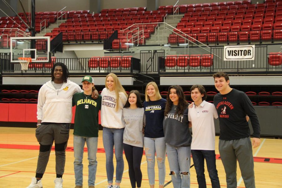 Coppell High School senior athletes Alvin Ebosele, Miles Hardy, Alyssa Hall, Haley Wenzel, ElleBelle Zimmerman, Sude Haz Item, Nathan Schrcok and Ryan Sewell signed letters of intent to their schools on Wednesday morning in Coppell High School Arena. Photo courtesy Illene Thomas