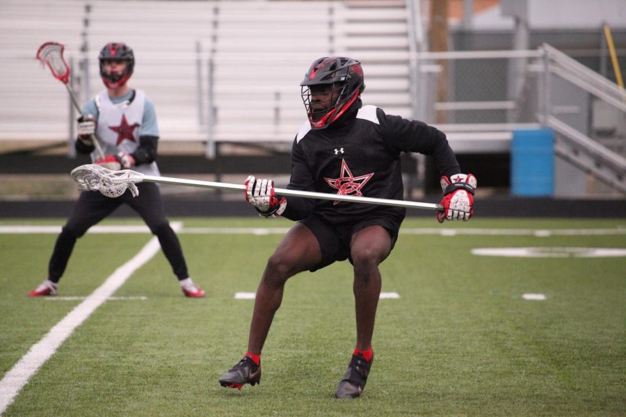 Coppell junior defender Malkam Wallace prepares to defend at practice on Tuesday at Lesley Field. Wallace is a dual sport athlete that portrays commitment and savors bonds with his teammates.