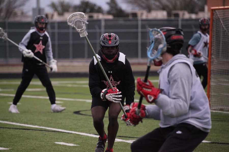 Coppell junior defender Malkam Wallace defends senior middie Logan Hazlewood at practice on Tuesday at Lesley Field. Wallace is a dual sport athlete that portrays commitment and savors bonds with his teammates.