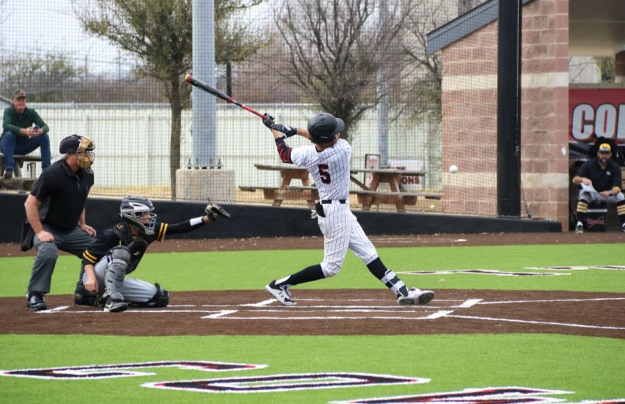 Coppell High School junior shortstop TJ Pompey bats against the Frisco Memorial Warriors. The Cowboys defeated the Warriors on Friday, 11-1.
