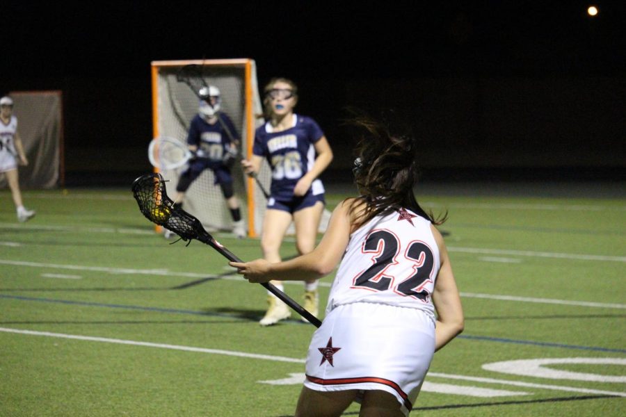 Coppell sophomore Ally Gunnels looks to score against Keller at Lesley Field on Friday. The Coppell girls lacrosse team defeated Keller, 14-12, in overtime. 