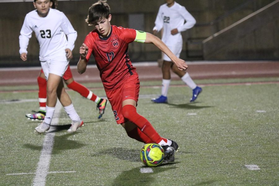 Coppell senior midfielder Walker Stone dribbles against Plano East on Feb. 12 at Buddy Echols Field against Plano East. The Cowboys play Allen tonight at 8 p.m. at McKinney ISD Stadium. 