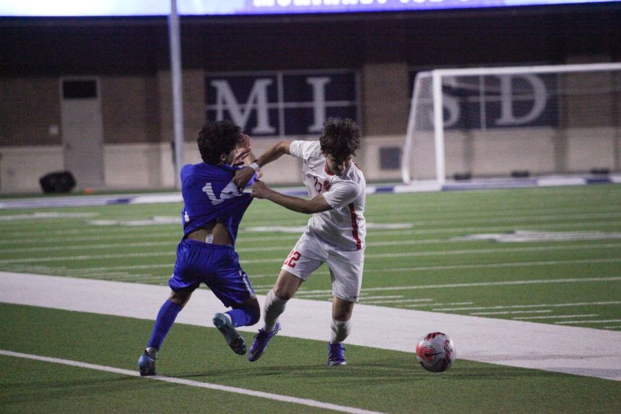 Coppell senior midfielder Pedro Peréz-Pareja steals against Allen junior defender Jackson Donato at McKinney ISD Stadium on Friday. Coppell ended its season after losing, 2-0, to Allen in the Class 6A Region I bi-district playoffs.