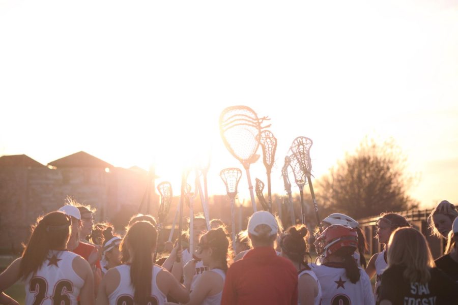 The Coppell girls lacrosse team breaks down during halftime against Rockwall on Thursday at Coppell Middle School North. The Cowgirls beat the Yellowjackets, 12-11, in overtime.