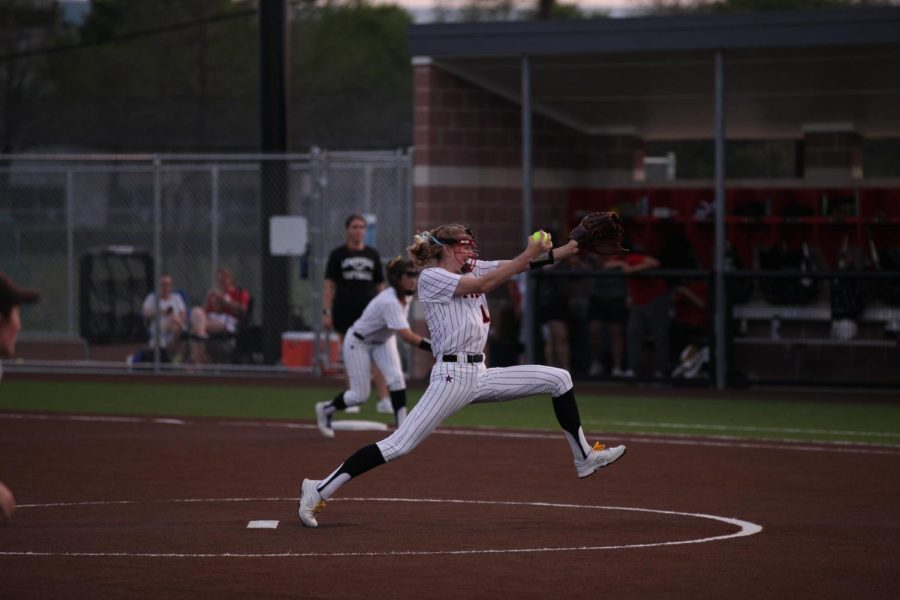 Coppell senior Kat Miller pitches against Lewisville on Friday at the Coppell ISD Baseball/Softball Complex. The Cowgirls beat the Farmers, 9-7.