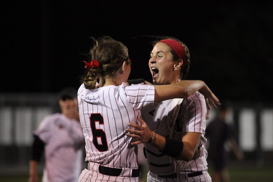 Coppell junior catcher Medleigh Danchak embraces sophomore pitcher Maddie Sigman after a win against Flower Mound on Friday at Coppell ISD Baseball/Softball Complex. After a scoreless five innings, Coppell beat Flower Mound, 3-2, to clinch the No. 2 seed from District 6-6A heading into this weeks playoffs.