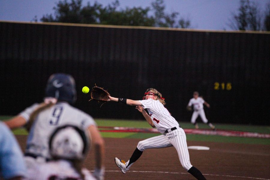Coppell senior pitcher Kat Miller catches a line drive from Flower Mound junior designated player Abigail Jennings at the Coppell ISD Baseball/Softball Complex on Friday. After a scoreless five innings, the Cowgirls beat the Jaguars, 3-2, to clinch the No. 2 seed in District 6-6A.