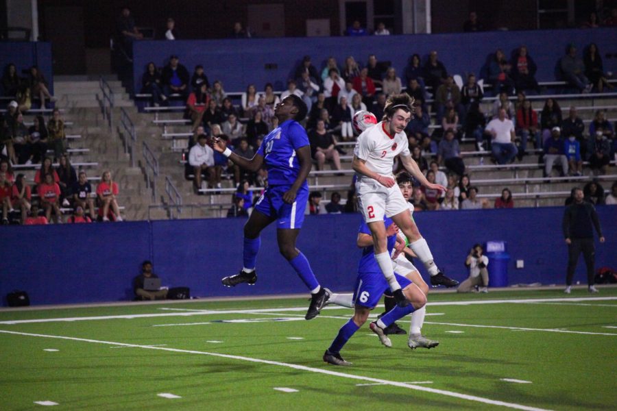 Coppell junior forward Ryder Brock heads against Allen sophomore forward Osi Iyamah at McKinney ISD Stadium on Friday. Coppell ended its season after losing, 2-0, to Allen in the Class 6A Region I bi-district playoffs.
