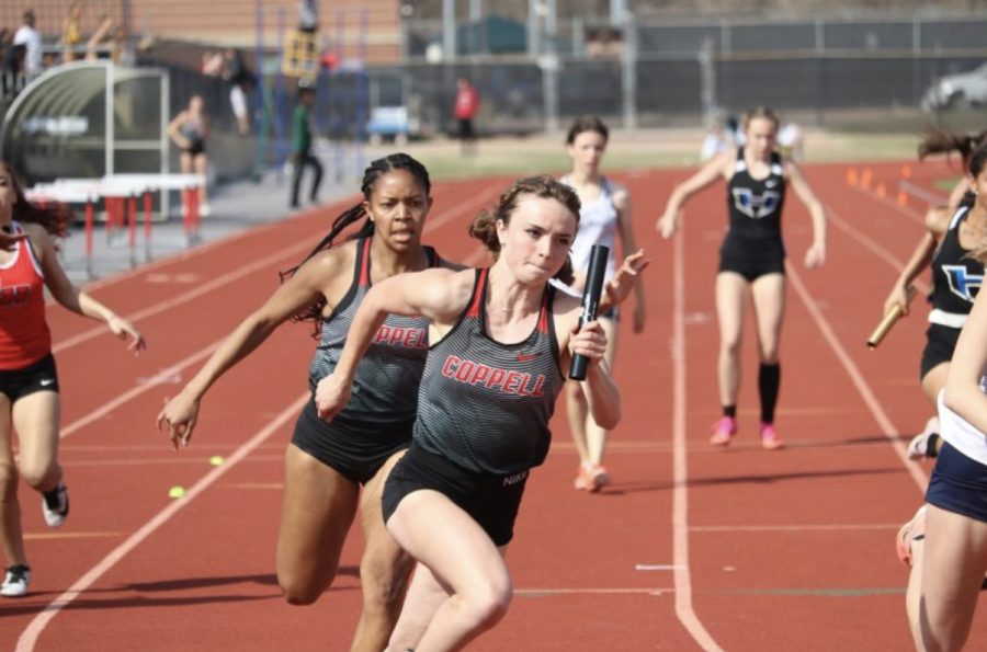 Coppell junior Megan Judd begins her leg of the 4x200-meter relay after receiving the baton from senior D’Aira Green at Buddy Echols Field on March 5 at the Coppell Relays. Last weekend, the Cowboys and Cowgirls competed in the Class 6A Region I Track and Field Meet seeking to qualify for state. 
