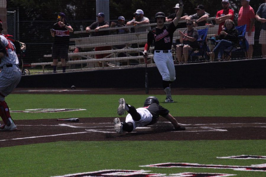 Coppell senior center fielder Carter Fields slides to score the Cowboy’s sixth run against Marcus on Saturday at Coppell ISD Baseball/Softball Complex. Coppell defeated the Marauders, 9-6, in a tiebreaker game to clinch the first seed in District 6-6A.