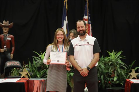 Coppell junior Sky Schuller and girls track coach Landon Wren are honored at the Coppell ISD Board of Trustees award ceremony held at the CHS Arena on Monday. Schuller competed in the Class 6A State Meet and finished sixth and second in the high jump and pole vault events respectively.