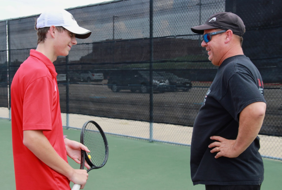 Coppell High School tennis coach Rich Foster converses with Coppell 2020 graduate Clark Parlier about captain duties on Oct. 3, 2019. Foster is retiring this year after coaching at Coppell for 29 years. Sidekick file photo.