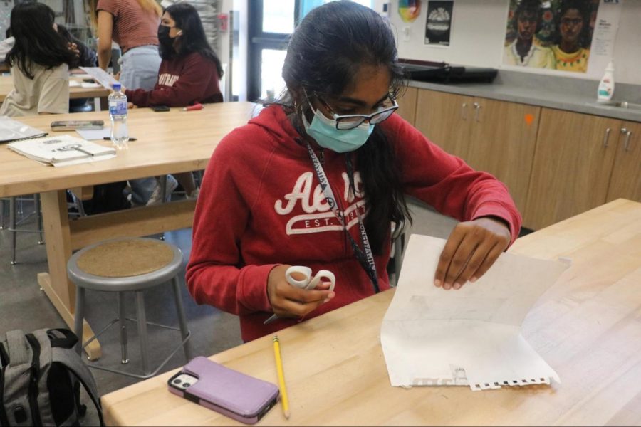 CHS9 student Maya Dudhyala transfers her design from a paper to a slab during seventh period on May 6. Dudhyala has been doing art since kindergarten and plans on taking a variety of art classes throughout high school.