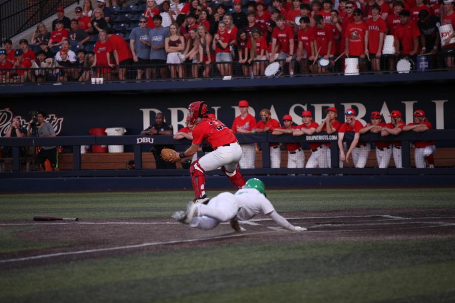 Southlake Carroll senior courtesy runner Brady Miller slides to score Carroll’s second run in Game 1 of the Class 6A Region I semifinals at Dallas Baptist University’s Horner Ballpark on Thursday. Carroll swept the series, winning Game 1, 4--0, and Game 2, 6-0, on Friday night. 