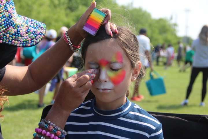 Lee Elementary School third grader Ashlyn Shaner gets a cat painted on her face by Coppell resident Rosymar Ramirez in the Coppell Nature Park on Saturday. The Coppell community celebrated Earthfest by hosting environmental education booths and activities around the park to teach people how they can lead a more sustainable lifestyle.