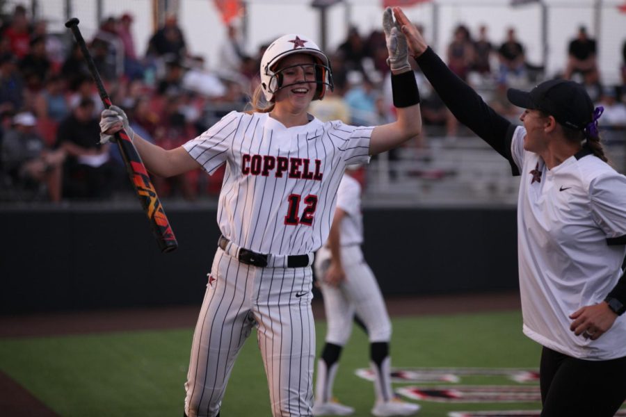 Coppell+assistant+coach+Kim+LeComte+congratulates+Coppell+junior+outfielder+Sabrina+Frosk+at+the+CISD+Baseball%2FSoftball+Complex+against+Lewisville+on+April+15.+LeComte+was+named+Coppell+coach+on+July+5+via+Twitter.+