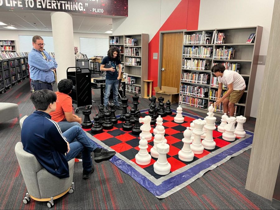 CHS9+students+Enzo+Madero+and+Alex+Garza+play+life+size+chess+in+the+CHS9+library+on+Aug.+24.+The+district%E2%80%99s+first+day+of+school+of+the+2022-23+school+year+was+on+Aug.+17.+Photo+courtesy+Amy+Kryzak