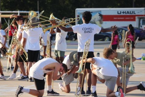 Coppell High School varsity band rehearses the Coppell Band 2022 marching show “Archetype” after school on Sept. 8. Among other changes to form a culture reset, the band will feature a new pre-game show performed by both JV and varsity members.