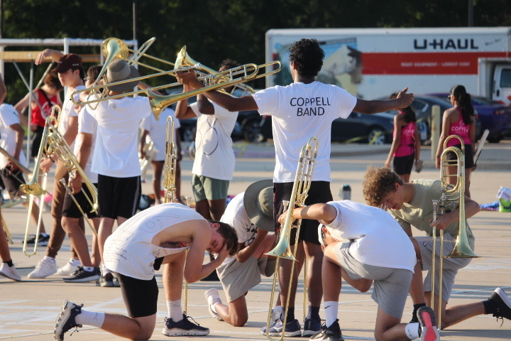 Coppell High School varsity band rehearses the Coppell Band 2022 marching show “Archetype” after school on Sept. 8. Among other changes to form a culture reset, the band will feature a new pre-game show performed by both JV and varsity members.