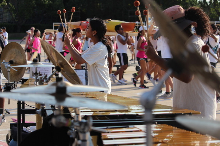 Coppell High School senior vibraphone Nivedita Anandaraj rehearses the Coppell Band 2022 marching show “Archetype” after school on Sept. 8. Among other changes to form a culture reset, the band will feature a new pre-game show performed by both JV and varsity members.