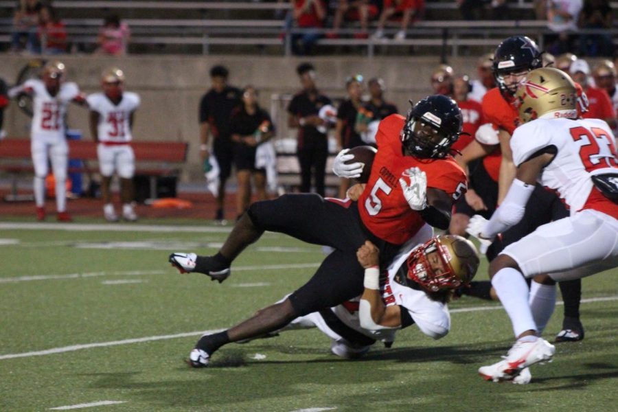 Coppell senior running back Malkam Wallace catches the ball on Friday at Buddy Echols field. Coppell wins against Grand Prairie, 30-26.