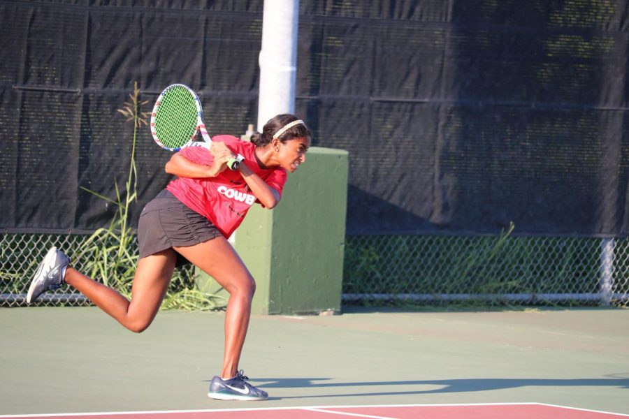 Coppell junior Zahra Shaikhali returns a ball in her doubles match against Houston Clear Brook on Friday at the Coppell Tennis Center. Shaikhali and her partner, Coppell junior Sriya Meduri, beat Houston Clear Brook, 6-2, 6-1. The Coppell tennis team beat Clear Brook, 16-3. 