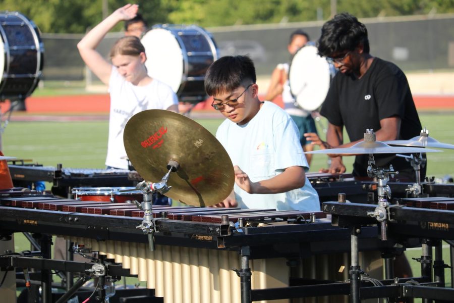 Coppell High School Band senior marimba Matthew Tindoc practices as part of the front ensemble at Buddy Echols Field on Sept. 16 before its competition at Dripping Springs High School. Coppell Percussion was named winner of the Advanced Large Division of the 2022 Thunder in the Hills Percussion Invitational.