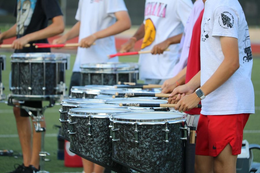 The Coppell High School Band’s snares and quads practice at Buddy Echols Field on Sept. 16 before its competition at Dripping Springs High School. Coppell Percussion was named winner of the Advanced Large Division of the 2022 Thunder in the Hills Percussion Invitational. 